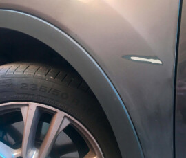 A dented and scratched bumper in Chelmsford - before